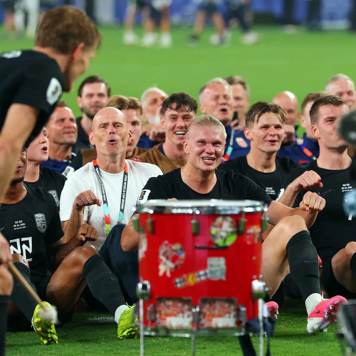 Norway coach Stale Solbakken, Erling Haaland and teammates perform the traditional Viking rowing celebration for their fans after the match on June 22.