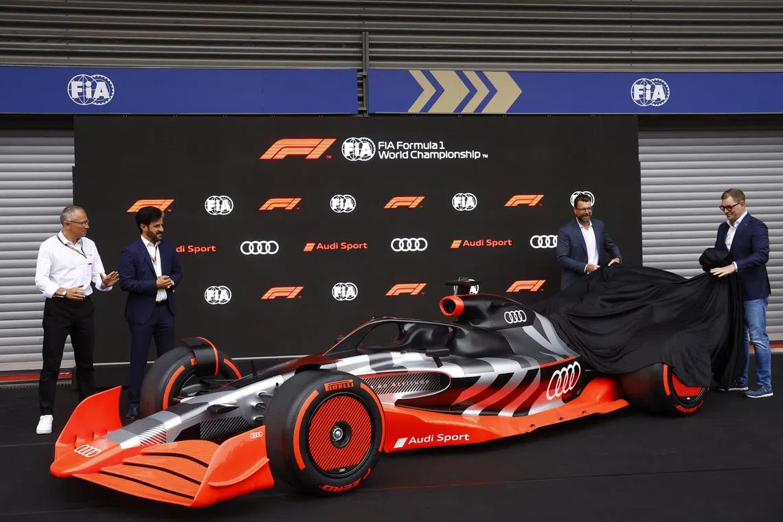 FILE PHOTO: Formula One F1 - Belgian Grand Prix - Spa-Francorchamps, Spa, Belgium - August 26, 2022 CEO of Formula One Group, Stefano Domenicali, FIA President Mohammed bin Sulayem, Chairman of the Board of Management of AUDI AG, Markus Duesmann and Audi Chief Development Officer, Oliver Hoffmann unveil the new Audi F1 car as German manufacturer Audi announce they will join the Formula 1 World Championship from the 2026 season as a power unit supplier REUTERS/Stephane Mahe/File Photo