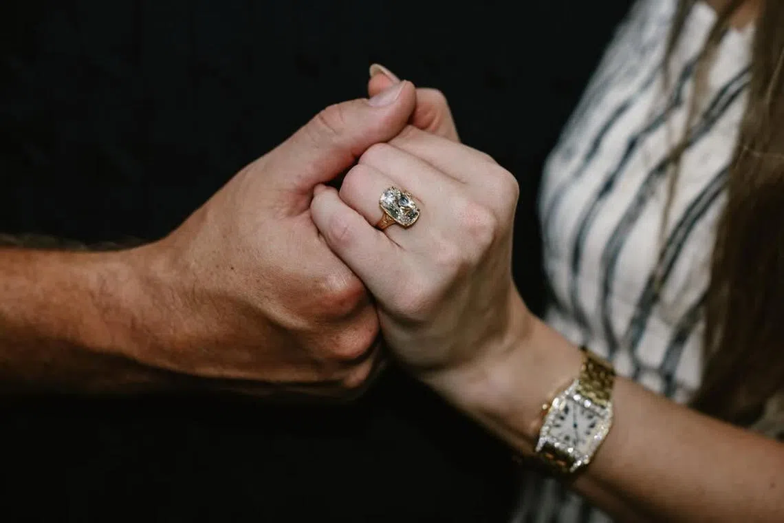 Taylor Swift announced her engagement to Travis Kelce in an Instagram post on Aug 26, revealing a large vintage-inspired ring on her finger.