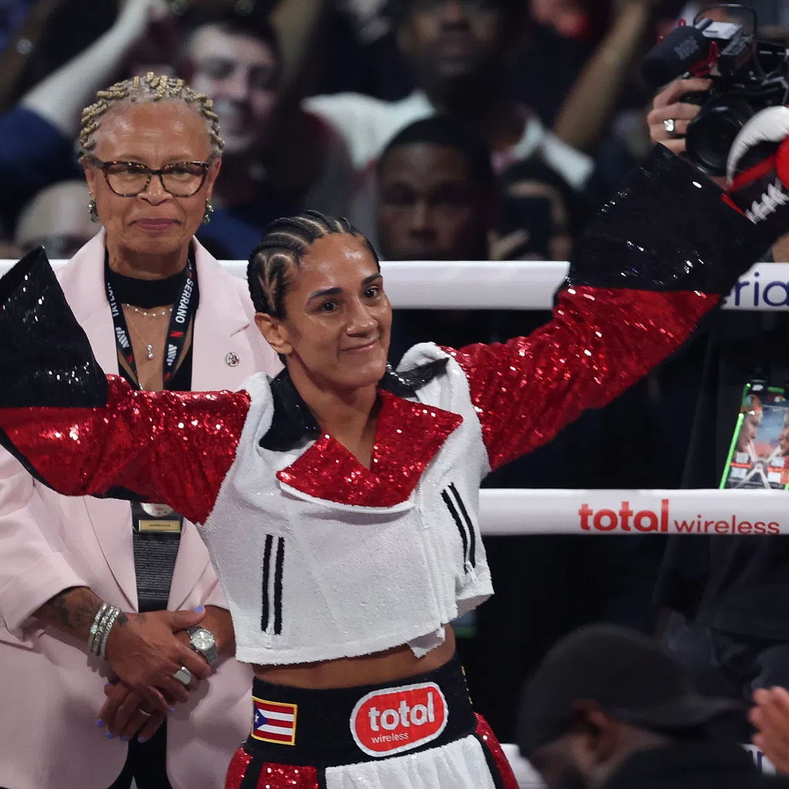 Jul 11, 2025; New York, New York, UNITED STATES; Amanda Serrano enters the ring before the undisputed super lightweight championship boxing bout against Katie Taylor at Madison Square Garden. Mandatory Credit: Vincent Carchietta-Imagn Images