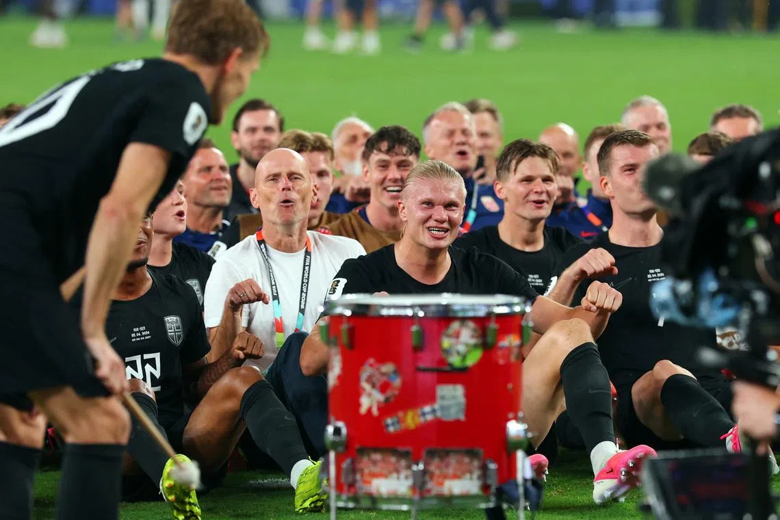 Norway coach Stale Solbakken, Erling Haaland and teammates perform the traditional Viking rowing celebration for their fans after the match on June 22.