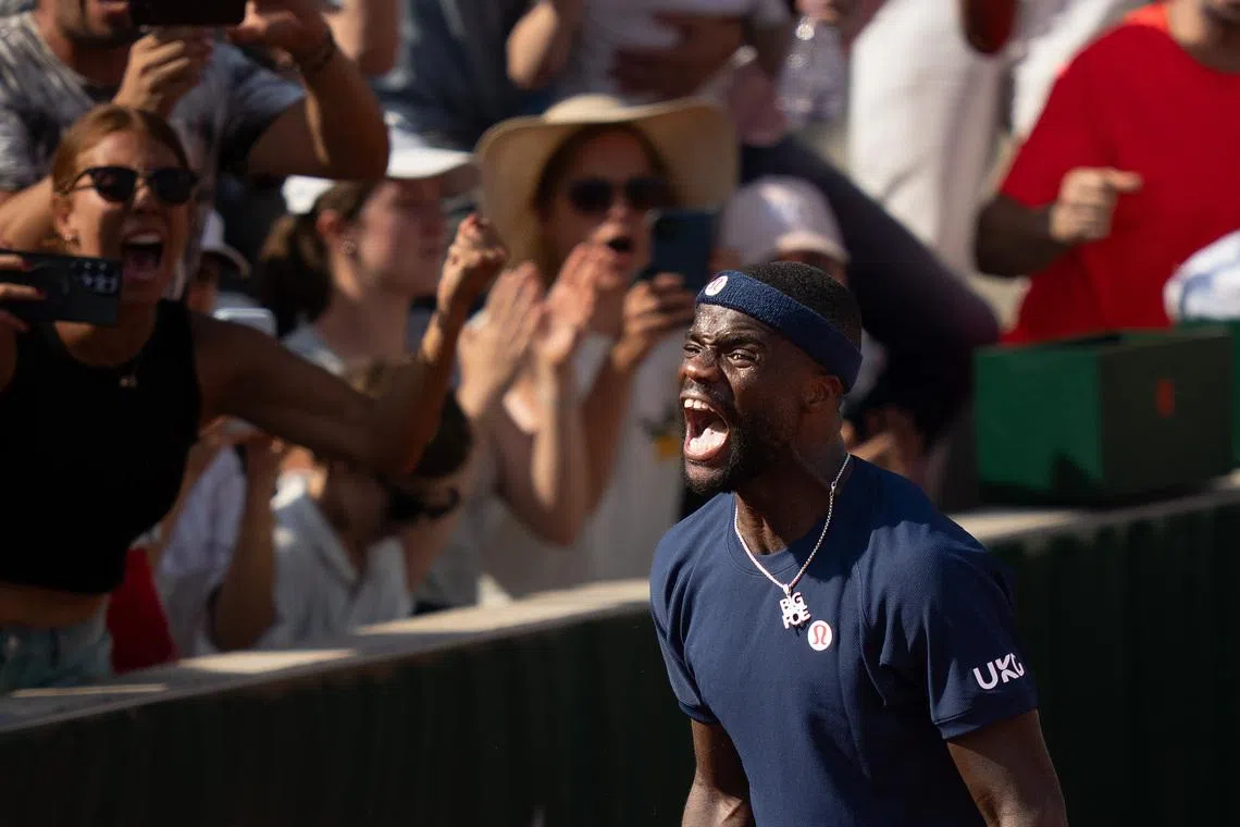 May 28, 2026; Paris, France; Frances Tiafoe of the United States celebrates winning his match against Hubert Hurkacz of Poland on day five at Stade Roland Garros. Mandatory Credit: Susan Mullane-Imagn Images