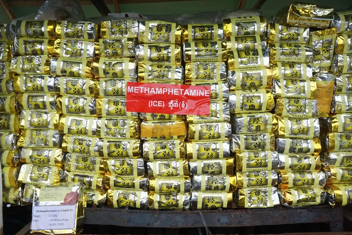 (FILES) A stack of illegal methamphetamine is pictured before being set on fire during a destruction ceremony to mark the United Nations' "International Day against Drug Abuse and Illicit Trafficking" in Yangon on June 26, 2021. Asian drug trafficking networks are increasingly using sea routes to smuggle methamphetamines out of Myanmar and ramping up ketamine production as they seek to expand their business, the UN warned on June 2, 2023. (Photo by AFP)