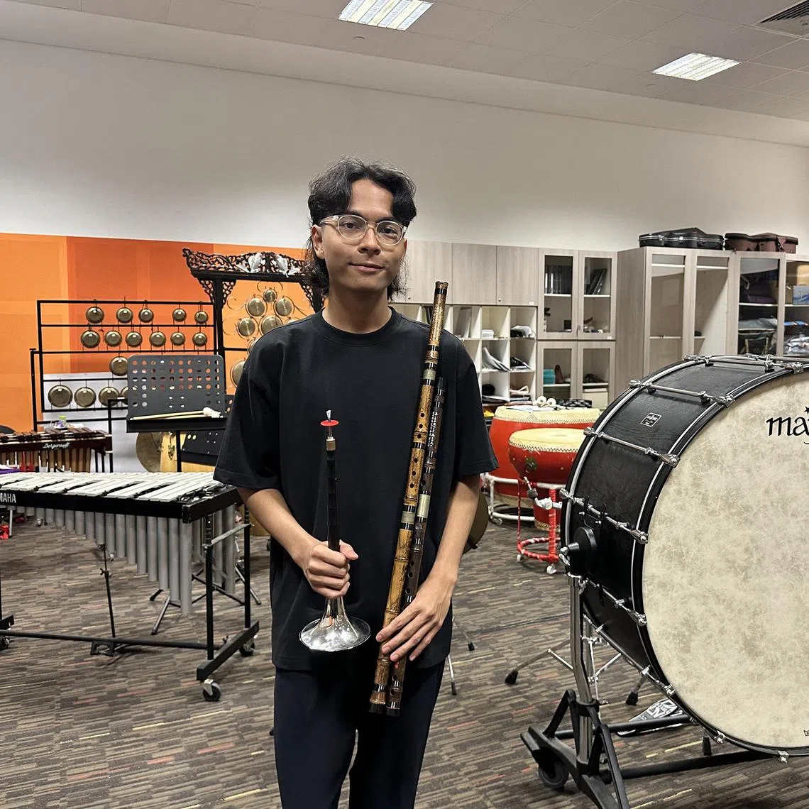 cworchestra - Muhammad Iman Mohamed Irfan, 18, is the only Malay musician and dizi player among the current students in Temasek Polytechnic’s Chinese orchestra

ST PHOTO: CHARLOTE WONG