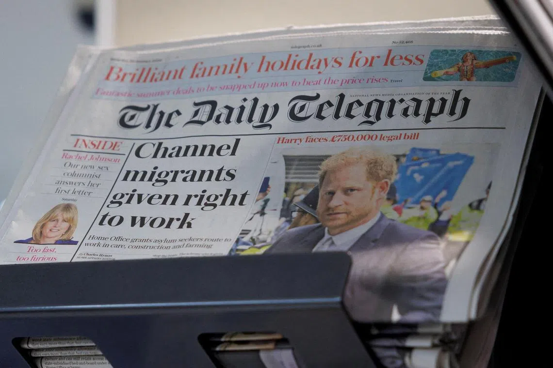 Copies of The Daily Telegraph are displayed on a rack in a supermarket in London, Britain on Jan 20, 2024.