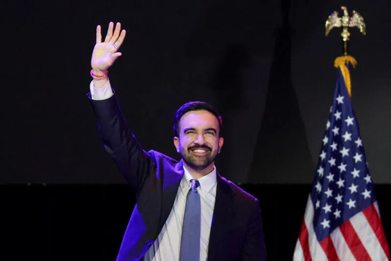 Democratic candidate Zohran Mamdani waving to supporters at a rally after winning the 2025 New York City mayoral race on Nov 4. 