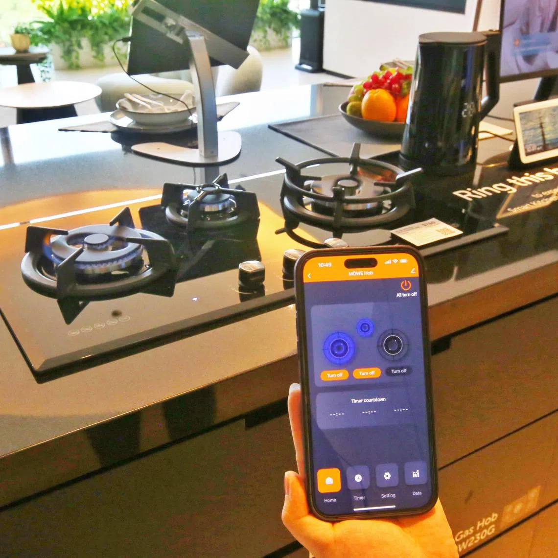 A gas hob operated via an app is among the smart devices for a green home showcased at City Energy's new store at Plaza Singapura.