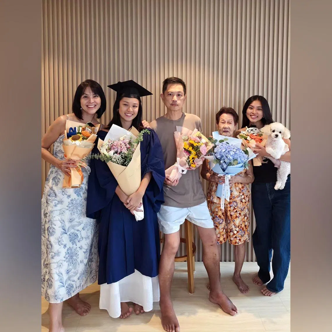Actor Chew Chor Meng (third from left), in a family photo to celebrate his daughter, Chloe (second from left), graduating from NUS with a degree in Communications.