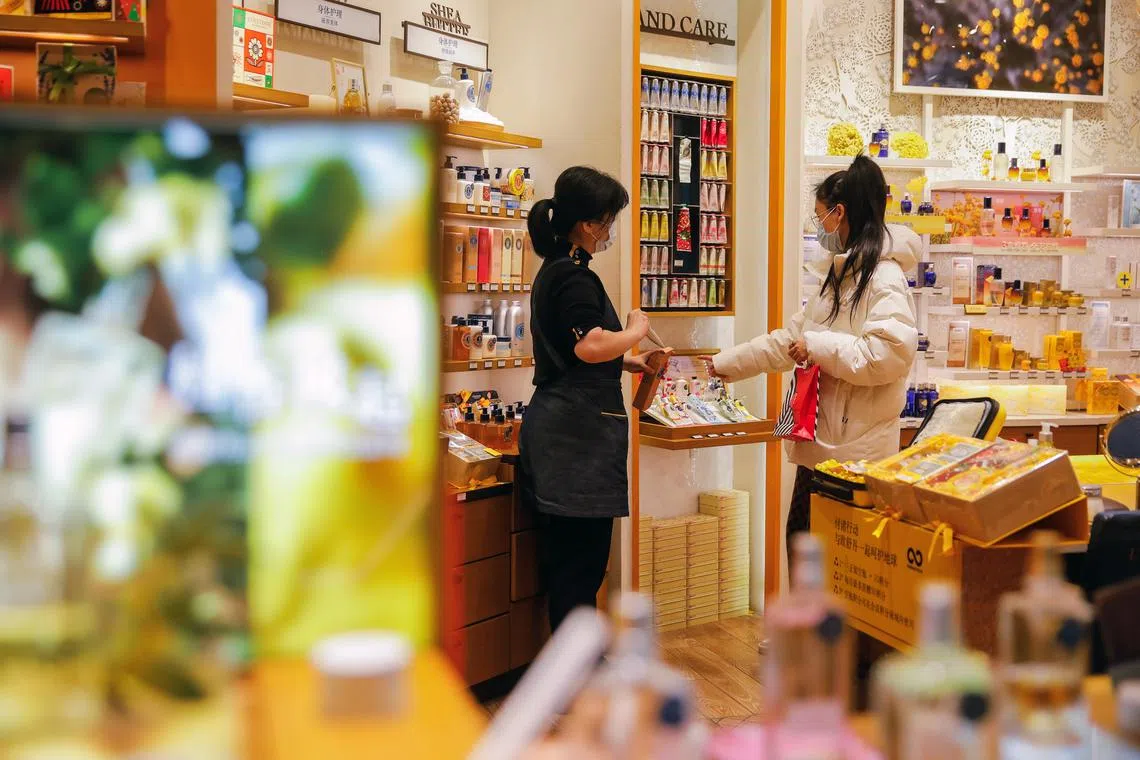 A woman shops at a store in Beijing on Nov 11, 2022.