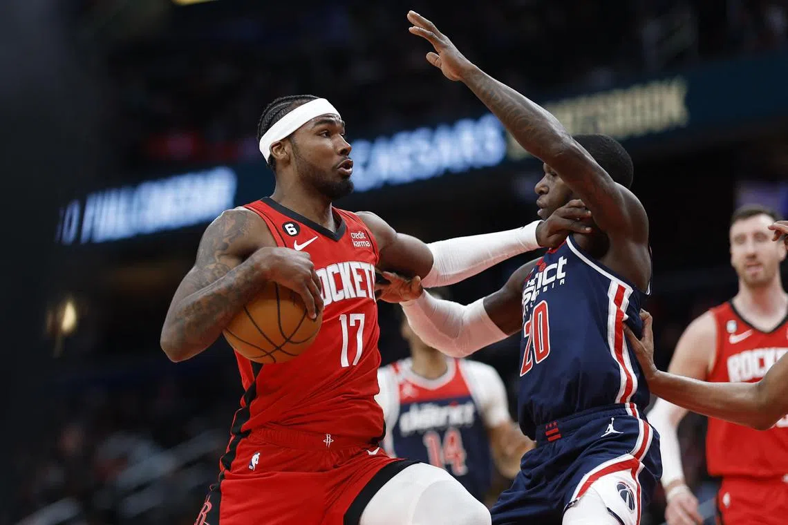 Houston Rockets forward Tari Eason driving to the basket as Washington Wizards guard Kendrick Nunn defends in the Rockets' 114-109 win on April 9. 