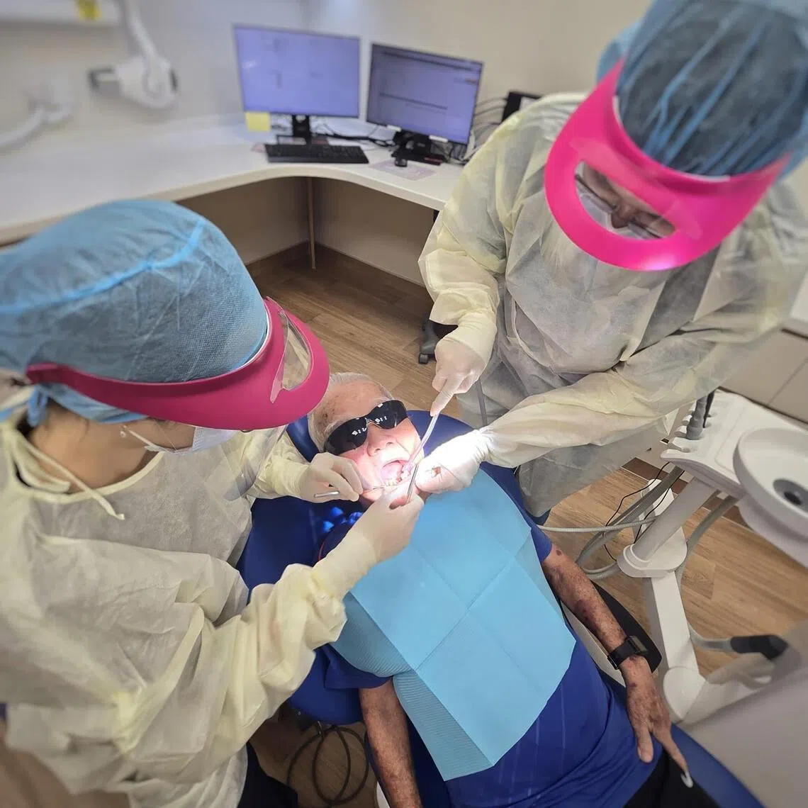 Mr Thung Joo Seng having his stitches removed after a front tooth extraction at the dental clinic in NHG Serangoon Polyclinic on April 14.