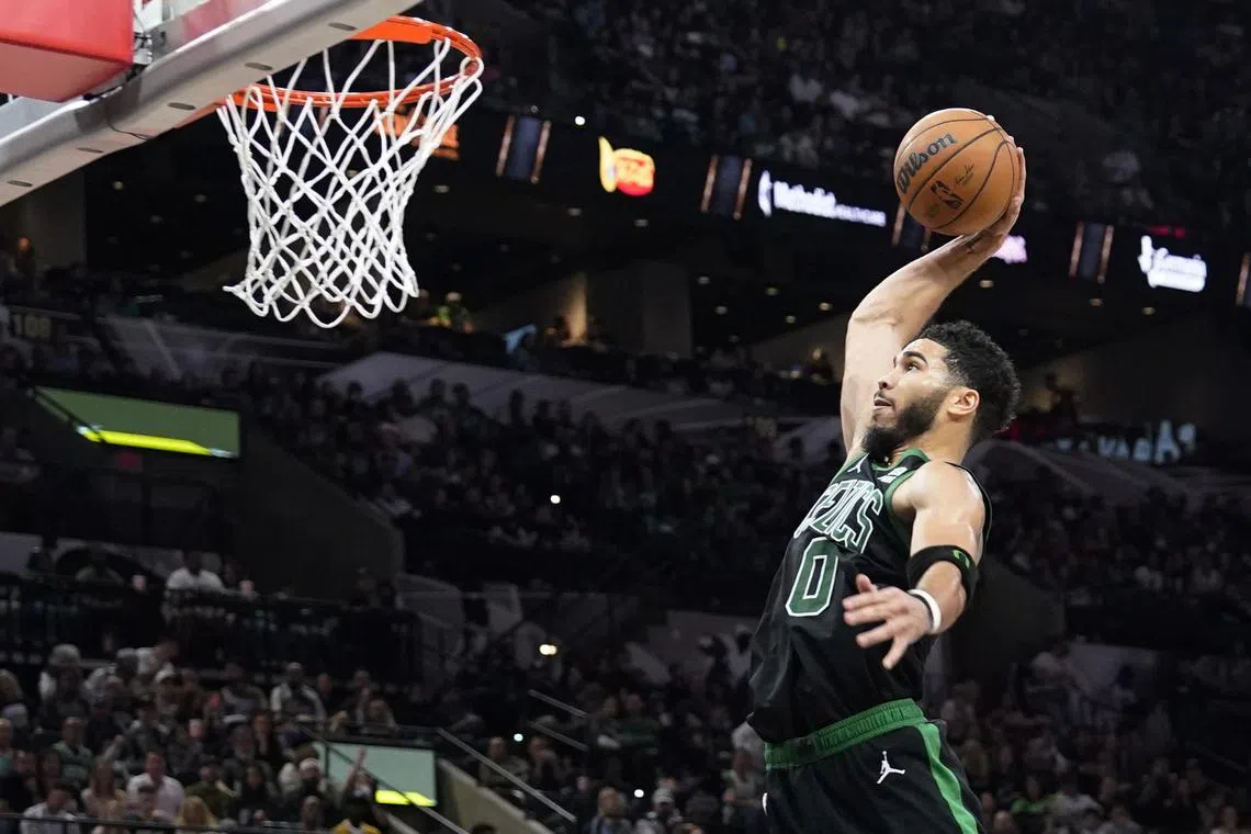 Boston Celtics forward Jayson Tatum dunks during the second half against the San Antonio Spurs at AT&T Centre.