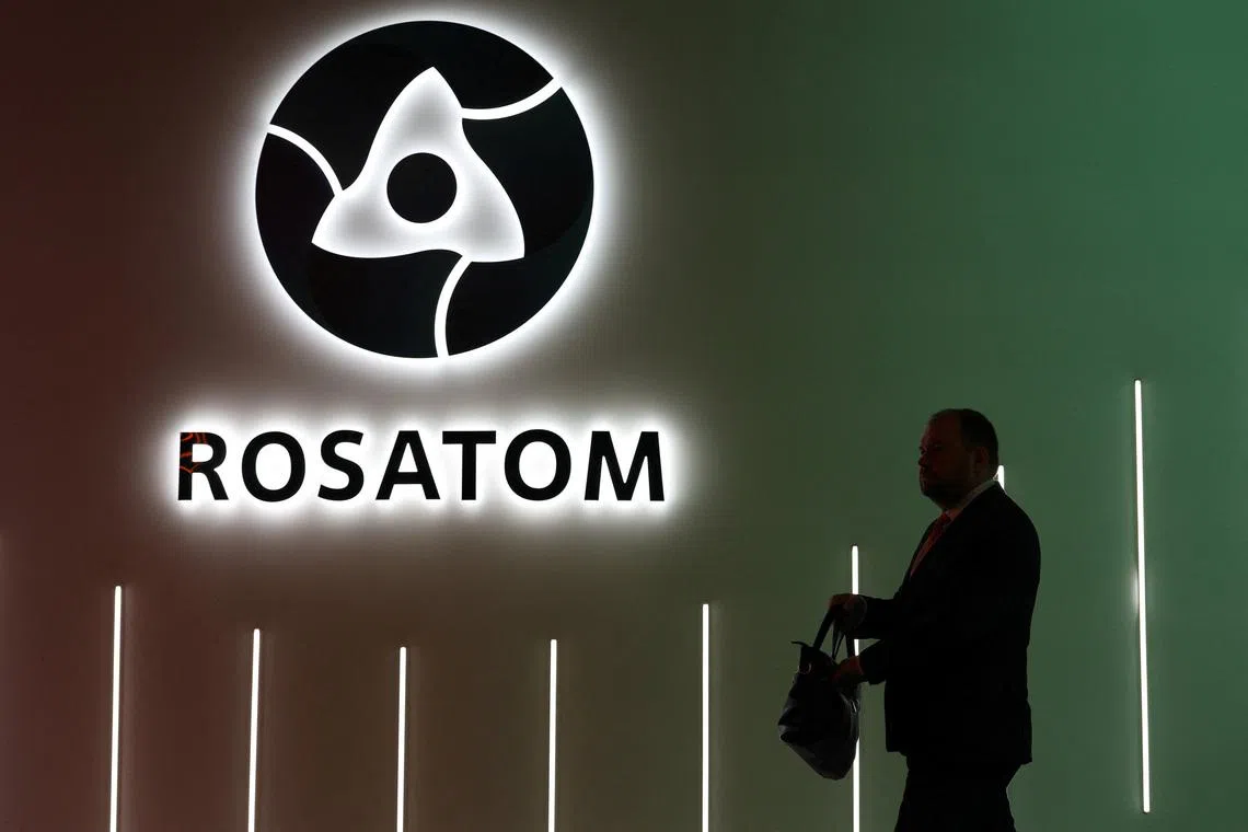 A participant walks past an exhibition stand of Russia's State Atomic Energy Corporation Rosatom at the Russian Energy Week international forum in Moscow, Russia, October 15, 2025. REUTERS/Ramil Sitdikov
