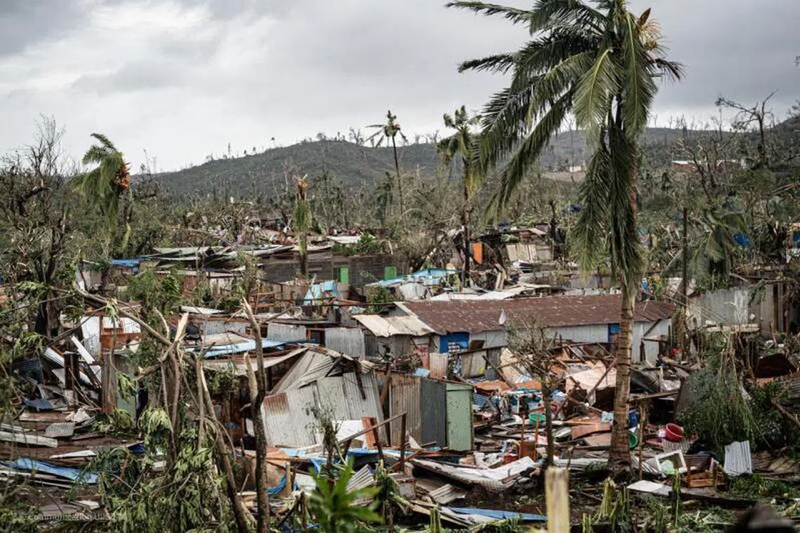 This handout photograph taken and released by the French Securite Civile on December 15, 2024 shows destroyed housing in Combani, on the French Indian Ocean territory of Mayotte, after the cyclone Chido hit the archipelago. Rescuers raced against time on December 16, 2024 to reach survivors and supply urgent aid after the devastating cyclone Chido ripped through the French Indian Ocean territory of Mayotte, destroying homes across the islands, with hundreds feared dead. (Photo by Handout / Securite Civile / AFP) / RESTRICTED TO EDITORIAL USE - MANDATORY CREDIT “AFP PHOTO / SECURITE CIVILE / HANDOUT” - NO MARKETING NO ADVERTISING CAMPAIGNS - DISTRIBUTED AS A SERVICE TO CLIENTS