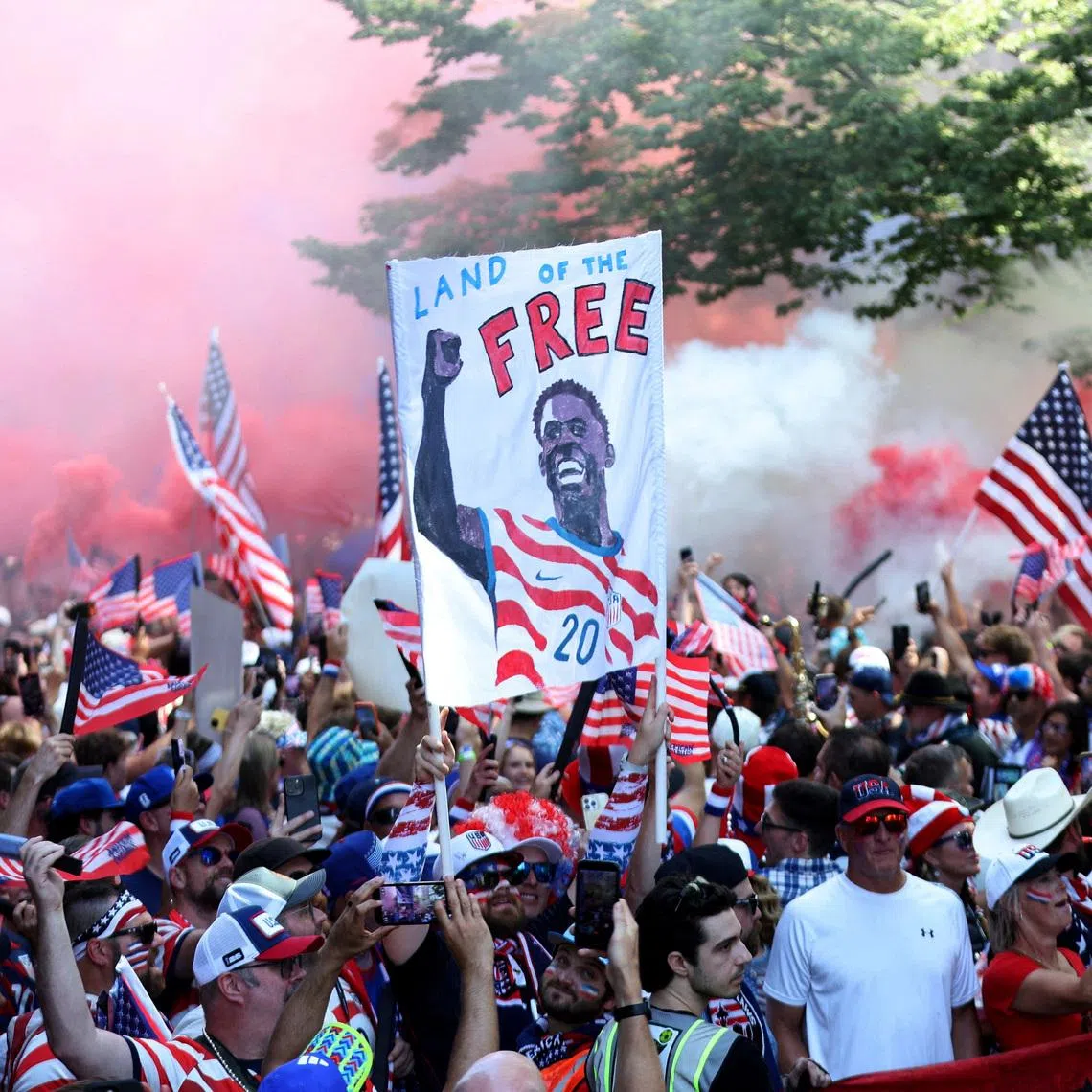 United States fans gather before the match with a Folarin Balogun banner in Seattle on July 6.