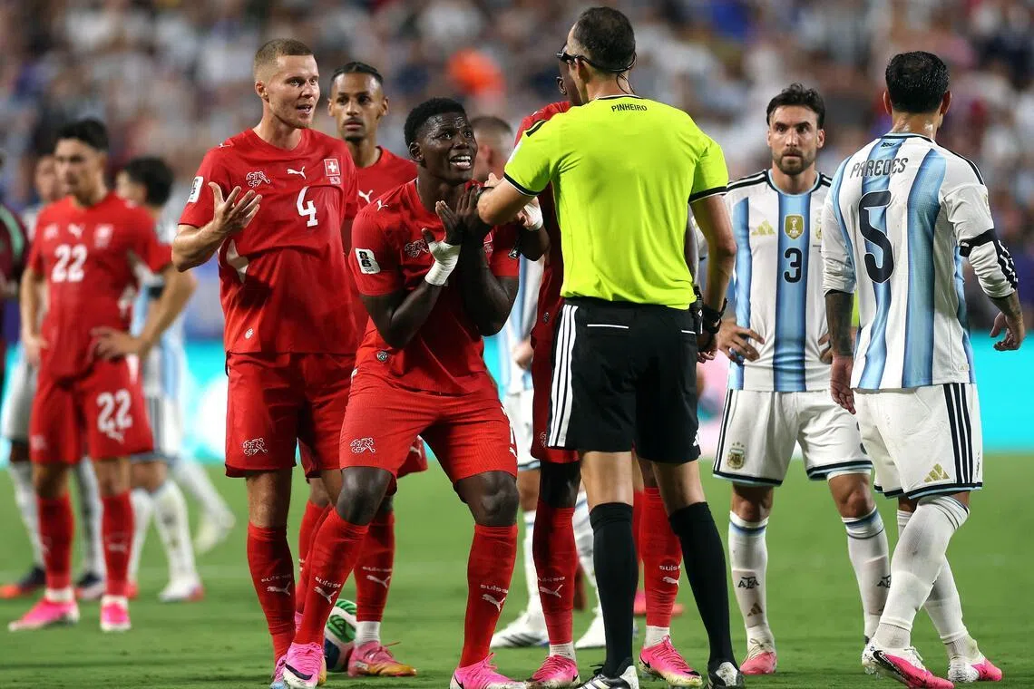Switzerland’s Breel Embolo pleading with referee Joao Pinheiro following his second yellow card and subsequent red card during their World Cup quarter-final against Argentina.
