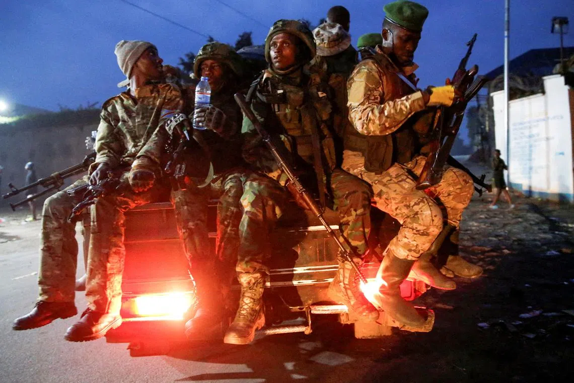 FILE PHOTO: Members of the M23 rebel group ride on a pickup truck as they leave their position for patrols amid conflict between them and the Armed Forces of the Democratic Republic of the Congo (FARDC), in Goma, eastern Democratic Republic of the Congo, January 29, 2025. REUTERS/Stringer/File Photo