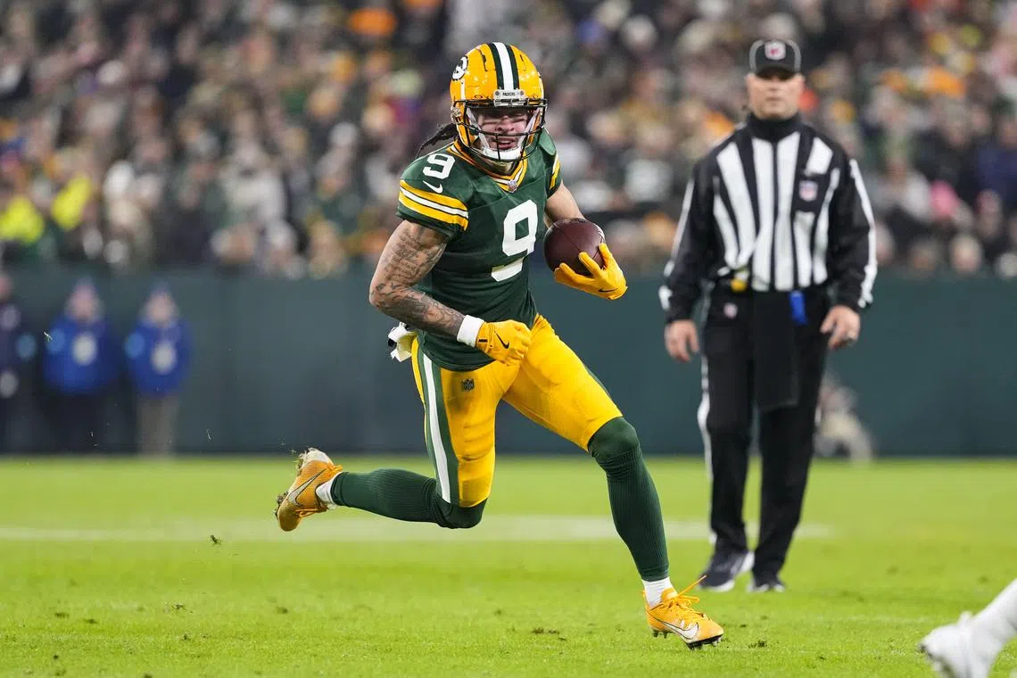 FILE PHOTO: Dec 23, 2024; Green Bay, Wisconsin, USA;  Green Bay Packers wide receiver Christian Watson (9) rushes with the football during the second quarter against the New Orleans Saints at Lambeau Field. Mandatory Credit: Jeff Hanisch-Imagn Images/File photo