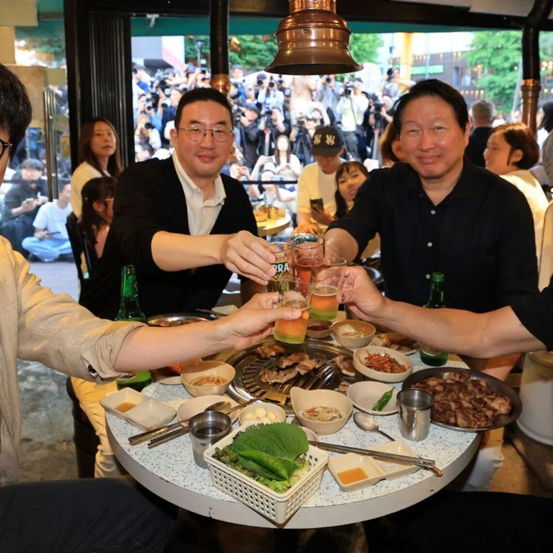 From right: Nvidia CEO Jensen Huang, SK Group Chair Chey Tae-won, LG Group Chairman Koo Kwang-mo and Naver founder Lee Hae-jin share pork belly and soju at Hyeongnim Jeoyo, a restaurant in Hongdae, Seoul, on June 5.