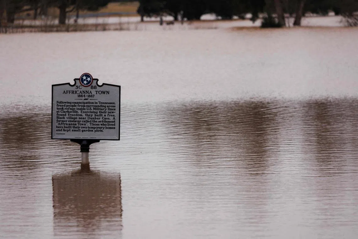 A historical marker is seen under flood waters on Feb 16, 2025 in Clarksville, Tennessee.