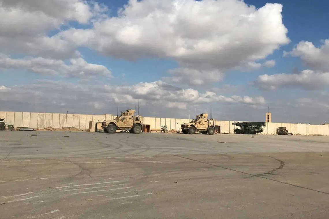 FILE PHOTO: Military vehicles of U.S. soldiers are seen at the al-Asad air base in Anbar province, Iraq, January 13, 2020. REUTERS/John Davison/File Photo