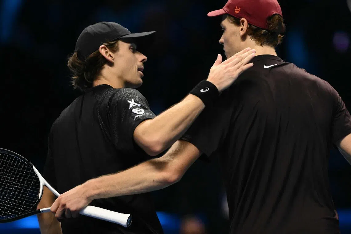 Italy's Jannik Sinner (right) interacting with Australia's Alex de Minaur after winning their semi-final at the ATP Finals tennis tournament in Turin on Nov 15, 2025. De Minaur also lost to Carlos Alcaraz of Spain earlier in the tournament.