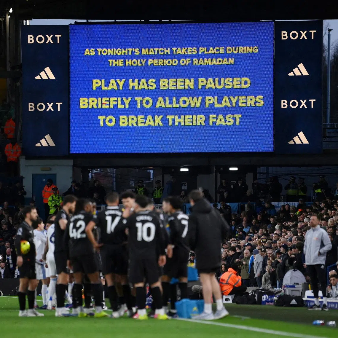 Soccer Football - Premier League - Leeds United v Manchester City - Elland Road, Leeds, Britain - February 28, 2026 A big screen displays a message as play stops to allow players to break their fast for Ramadan REUTERS/Jaimi Joy