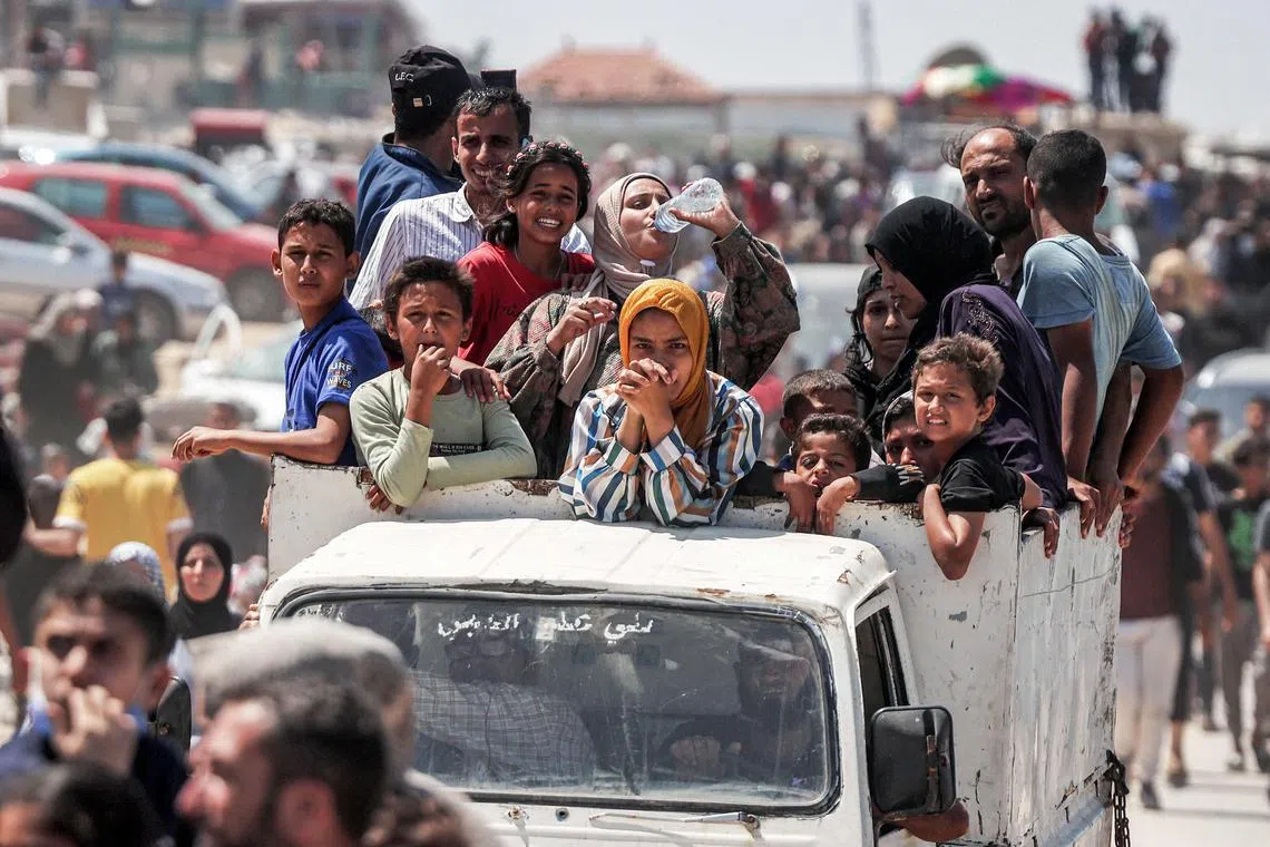 Displaced Palestinians travelling along the coastal Rashid road en route to Gaza City, on April 14, 2024.