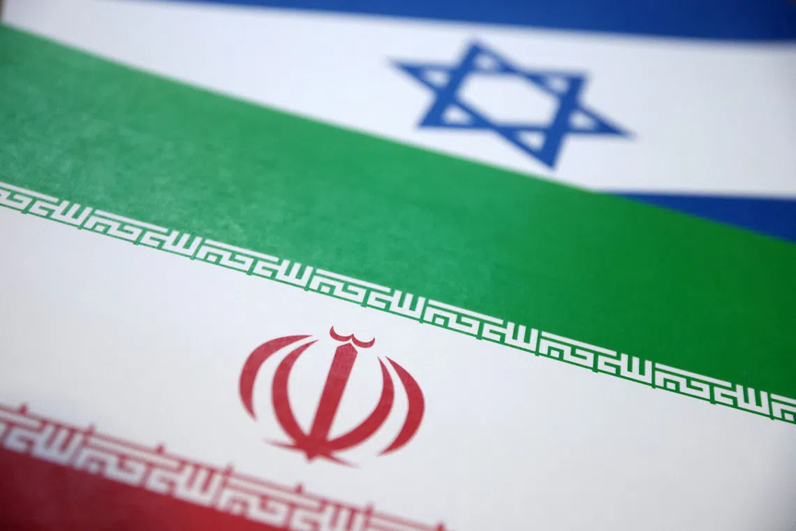 Israel and Iran flags are seen in this illustration taken June 18, 2025. REUTERS/Dado Ruvic/Illustration