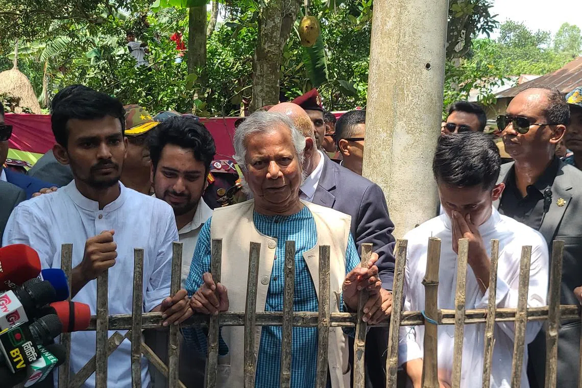 Dr Yunus (centre) was acquitted in a labour violation case in which he had been sentenced to six months in jail. 