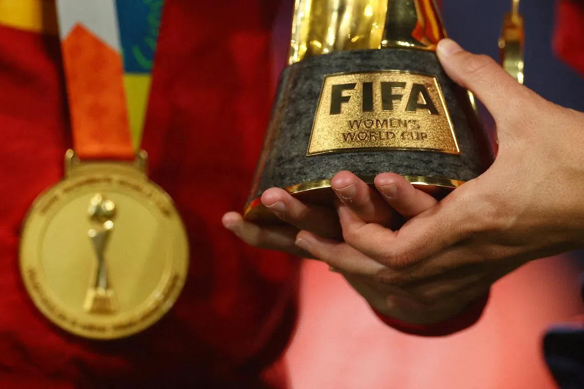 FILE PHOTO: Soccer Football - FIFA Women's World Cup Australia and New Zealand 2023 - Final - Spain v England - Stadium Australia, Sydney, Australia - August 20, 2023 General view of a Spain player holding the World Cup trophy after the match REUTERS/Carl Recine/File Photo