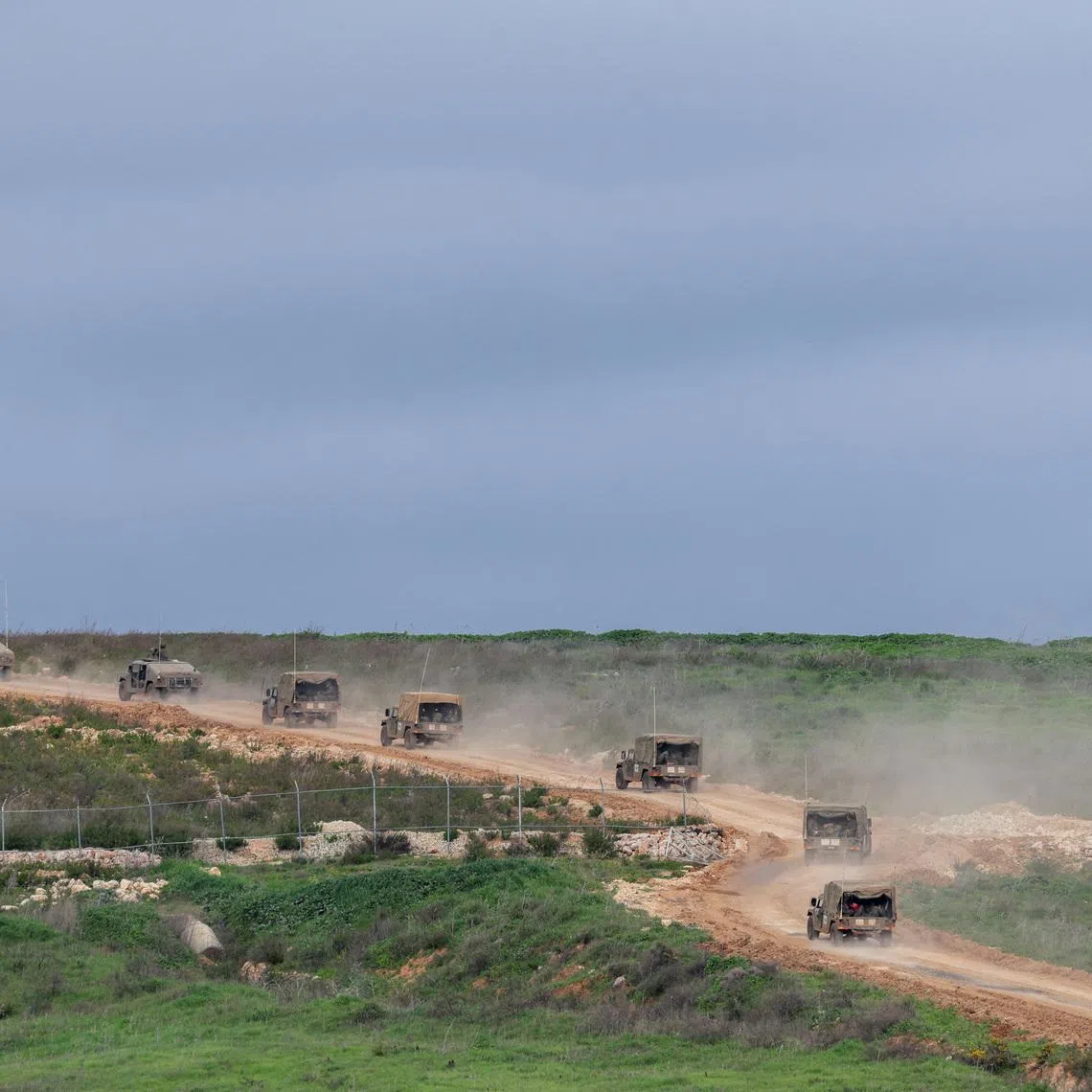 Israeli military jeeps drive to the border with Lebanon, amid escalating hostilities between Israel and Hezbollah, as the U.S.-Israeli conflict with Iran continues, in northern Israel, March 25, 2026. REUTERS/Tyrone Siu
