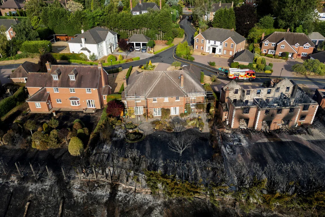 A drone view of a burnt-out house following a large grass fire which spread to several homes yesterday during the hottest day of the year, in Stourbridge, West Midlands, Britain, August 14, 2026. REUTERS/Temilade Adelaja