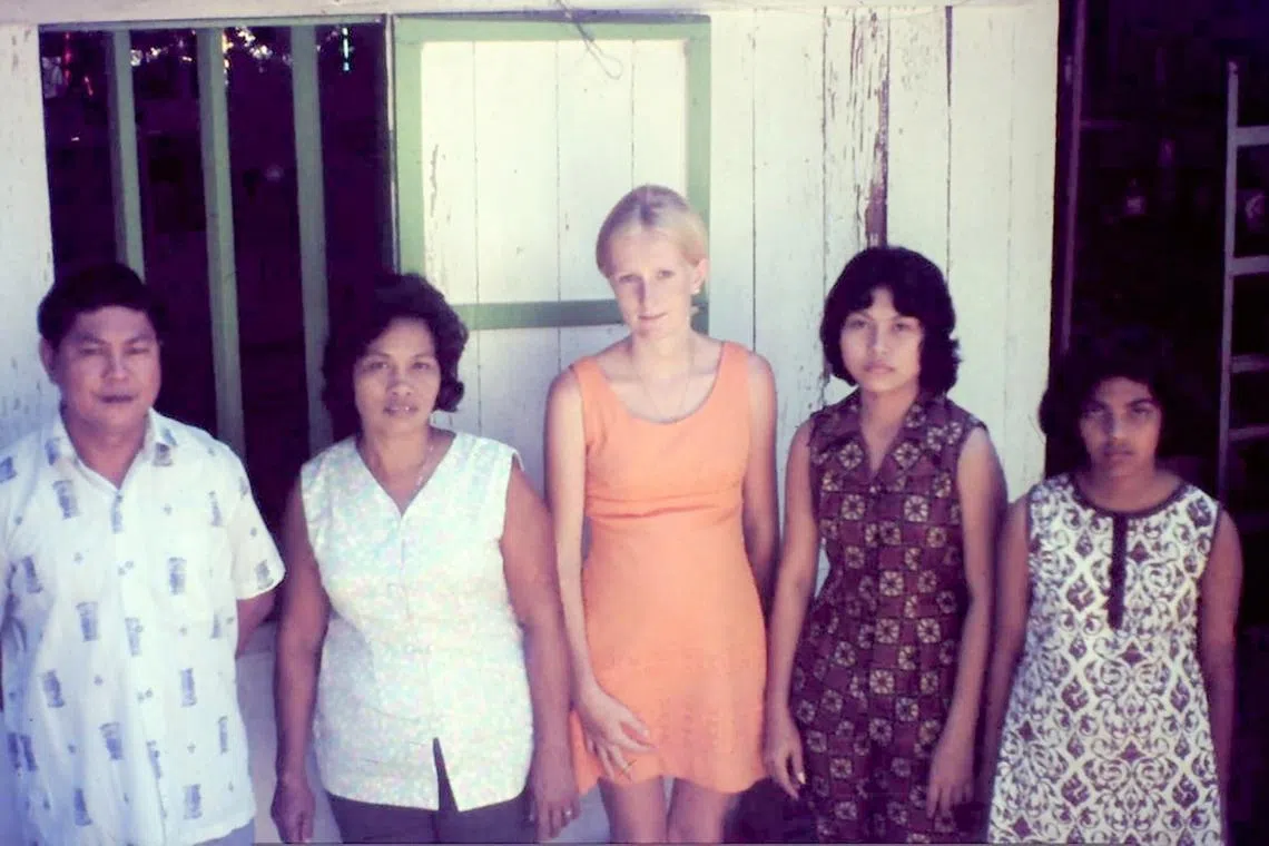  Mrs Laurie Rands (centre) with Mrs Lily Wong’s family pictured in the 1970s.