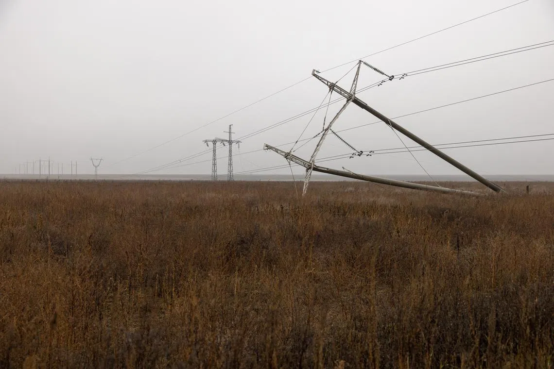Destroyed power lines are seen outside Kherson, Ukraine, on Nov 26, 2022.