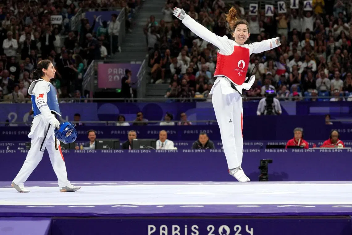 FILE PHOTO: Paris 2024 Paralympics - Taekwondo - Women K44 -47kg Repechage - Grand Palais, Paris, France - August 29, 2024  Zakia Khudadadi of Refugee Paralympic Team celebrates winning her fight against Nurcihan Ekinci of Turkey REUTERS/Maja Smiejkowska/File Photo