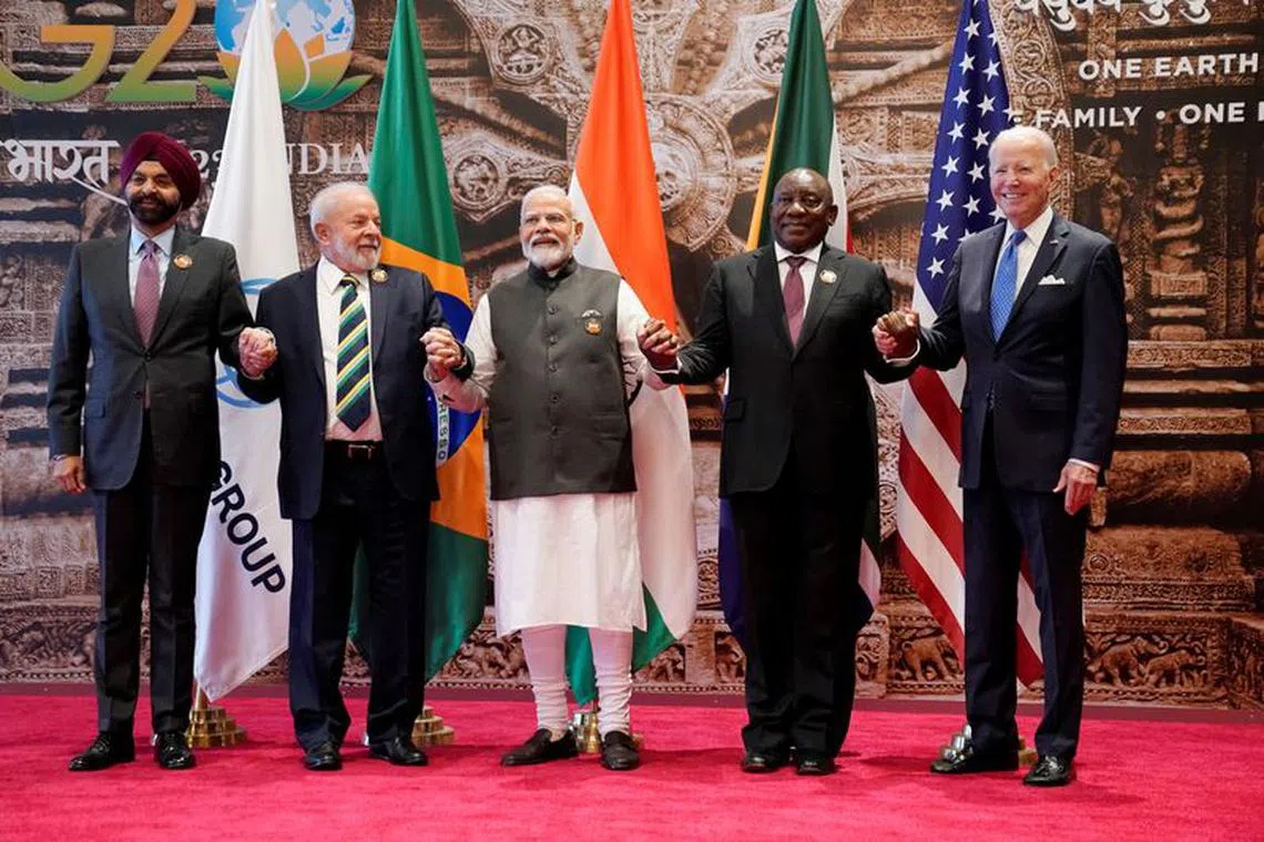 World Bank President Ajay Banga, Brazilian President Luiz Inacio Lula da Silva, Indian Prime Minister Narendra Modi, South African President Cyril Ramaphosa and South African President Cyril Ramaphosa and U.S. President Joe Biden pose for the group photo during G20 Summit, in New Delhi, India, Saturday, Sept. 9, 2023  Evan Vucci/Pool via REUTERS
