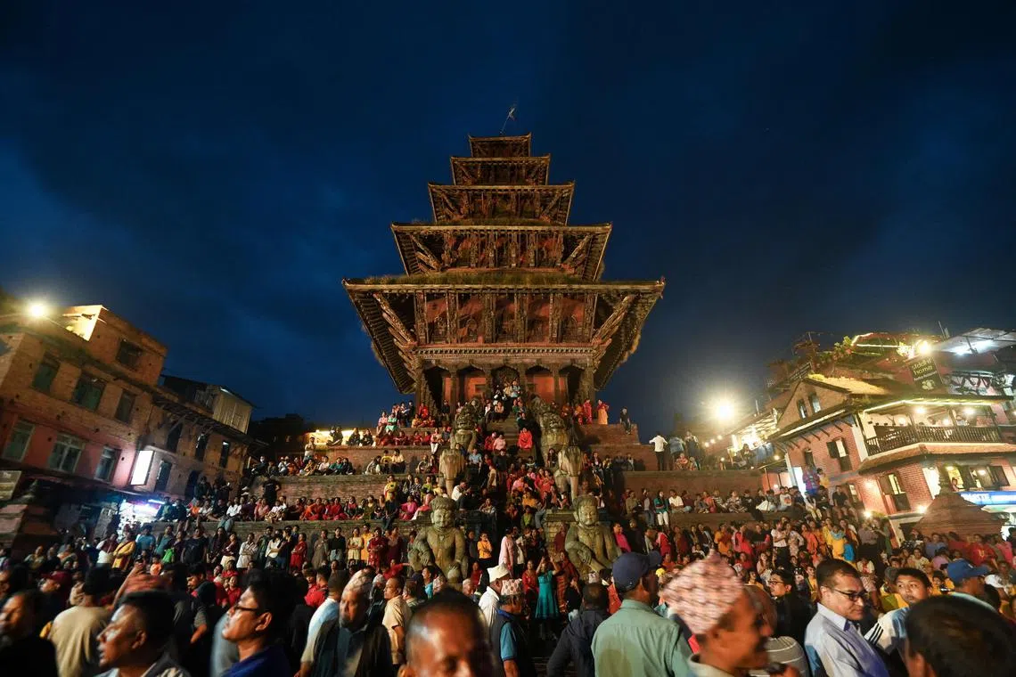 Devotees gathering to worship the 'Dipankar Buddha' on the occasion of 'Pancha Daan' festival in Bhaktapur on the outskirts of Kathmandu on Sept 12.