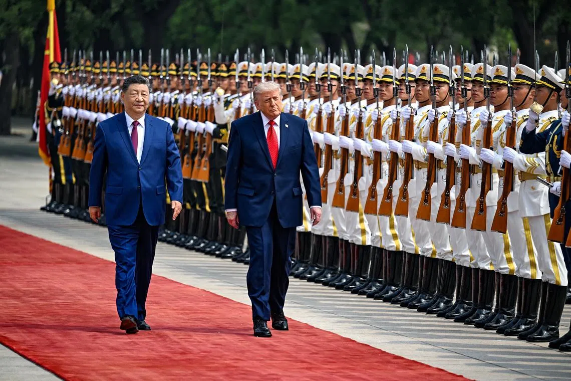 U.S. President Donald Trump reviews the troops with the President of the People’s Republic of China Xi Jinping, in Beijing, China, May 14, 2026, during a trip focused on trade, regional security, and strengthening bilateral ties between the world’s two largest economies. Kenny Holston/Pool via REUTERS