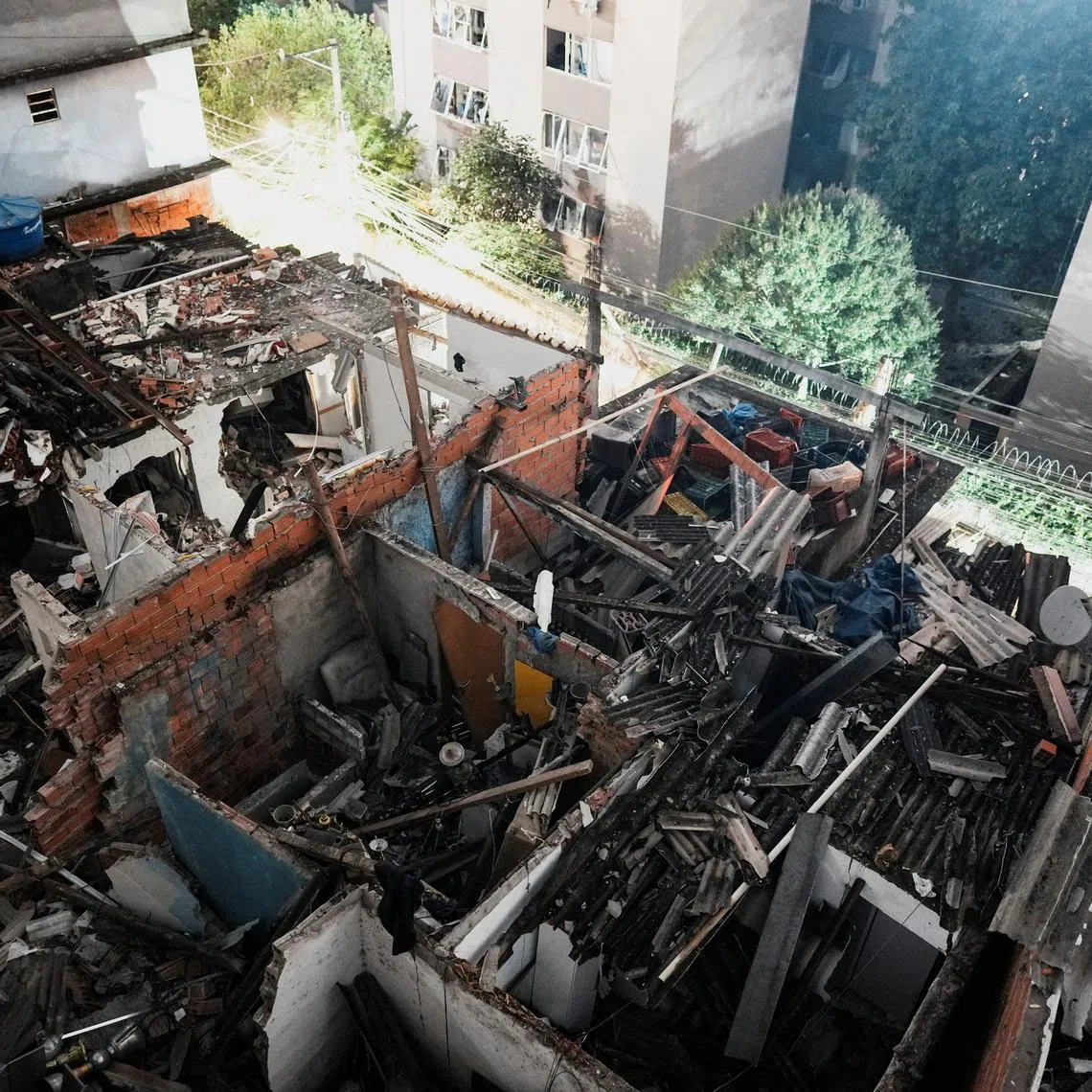 View of the site where a fire set off by a potential gas explosion damaged homes and injured people, according to the local fire department, in Sao Paulo, Brazil, May 11, 2026.