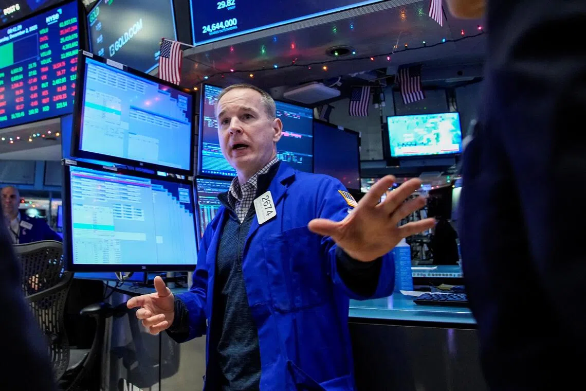 A trader working on the floor of the New York Stock Exchange, in New York City, on Dec 2.