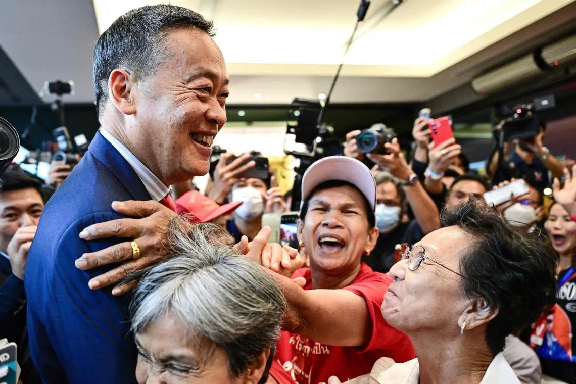 Pheu Thai’s Mr Srettha Thavisin with supporters at the party’s headquarters on Aug 22 after he was backed by lawmakers to become Thailand’s prime minister.