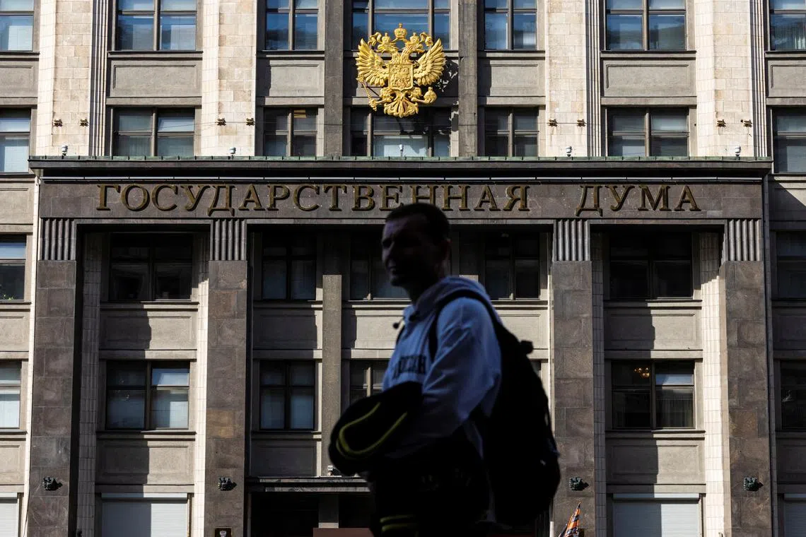 A man passes by the State Duma building, the lower chamber of Russian parliament in Moscow, Russia, September 24, 2024. REUTERS/Maxim Shemetov