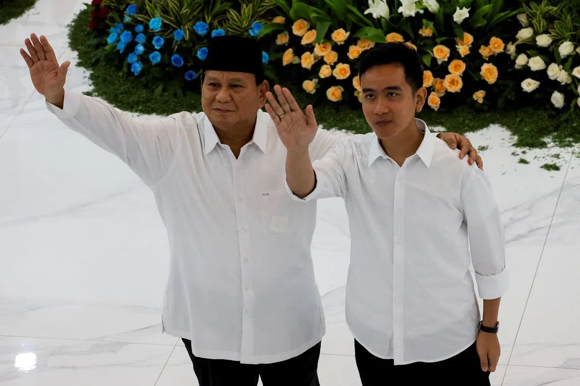 Indonesia's president-elect Prabowo Subianto and vice president-elect Gibran Rakabuming Raka wave after the country's election commission officially announced them as the presidential election winners at General Election Commission (KPU) headquarters in Jakarta, Indonesia, April 24, 2024. REUTERS/Ajeng Dinar Ulfiana
