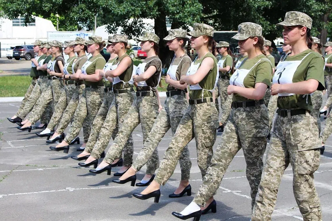 A file photo of Ukrainian female soldiers wearing heels while taking part in the military parade rehearsal in Kyiv in July 2021. 