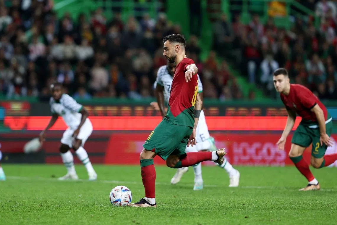Portugal's Bruno Fernandes scoring their second goal from the penalty spot against Nigeria on Thursday. 