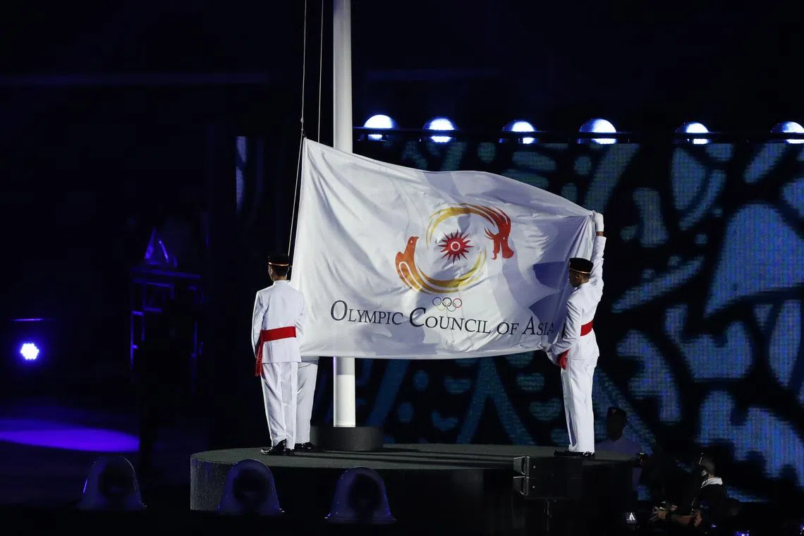 FILE PHOTO: 2018 Asian Games - Closing Ceremony - GBK Main Stadium - Jakarta, Indonesia - September 2, 2018 - The Olympic Council of Asia flag is lowered. REUTERS/Issei Kato/File Photo
