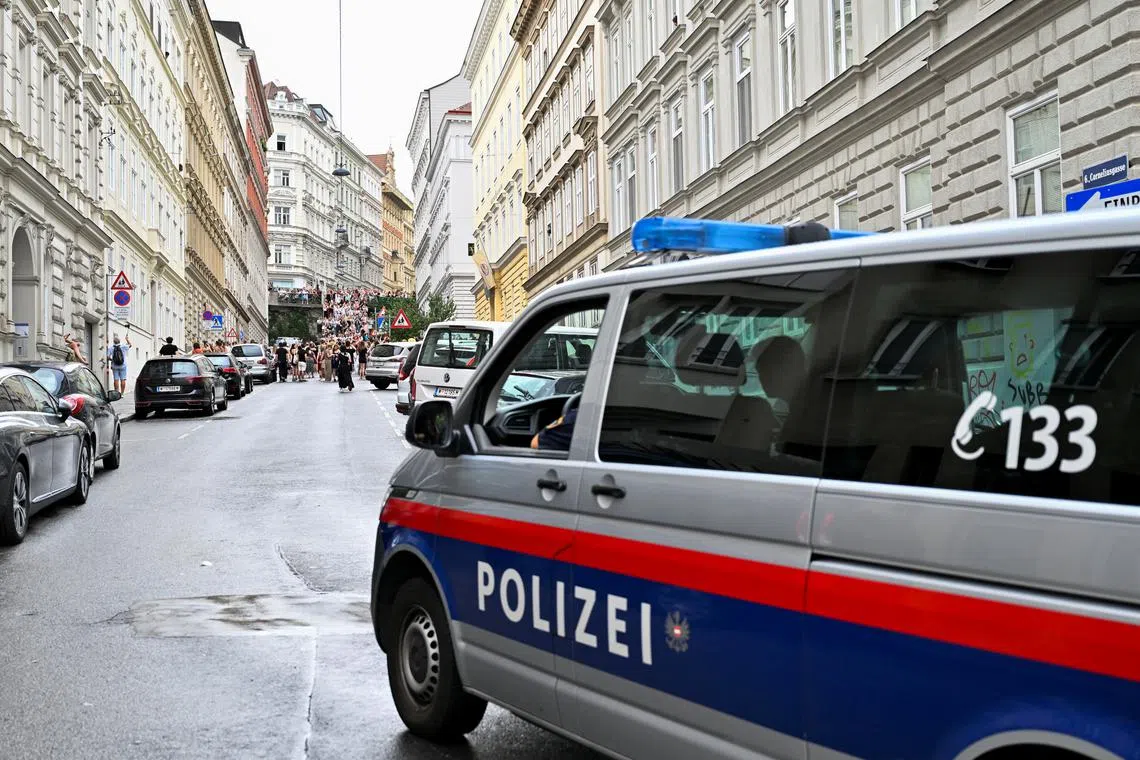 A police vehicle patrols as fans of the singer Taylor Swift gather following the cancellation of three Taylor Swift concerts at Happel stadium after the government confirmed a planned attack at the venue, in Vienna, Austria August 8, 2024. REUTERS/Elisabeth Mandl/File Photo