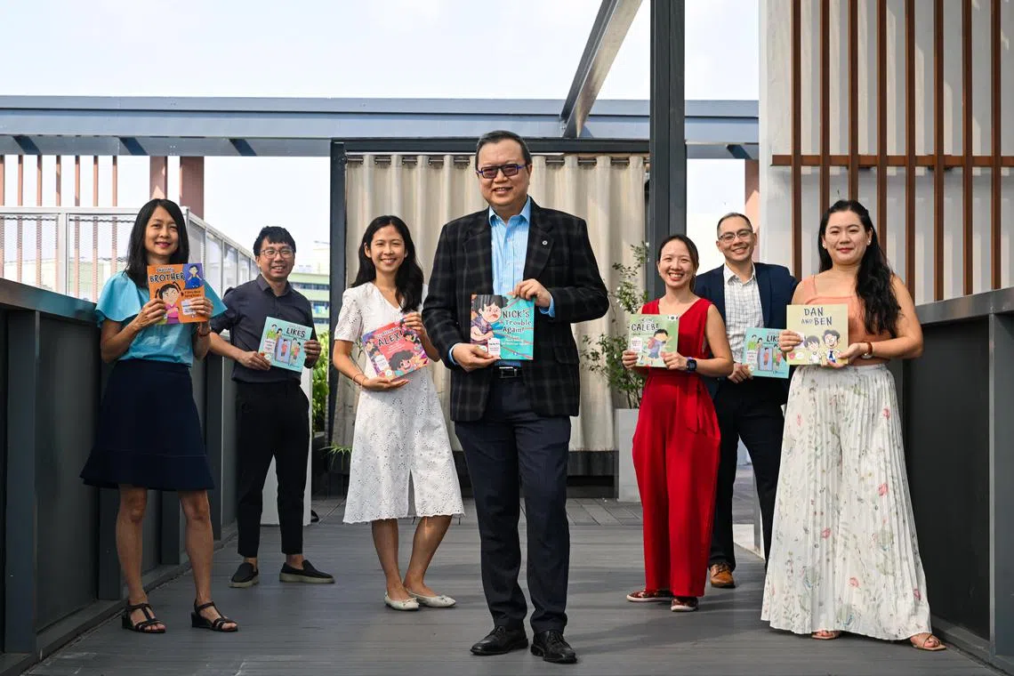 Dr Ong Say How (centre), chief of IMH’s department of developmental psychiatry, with his colleagues and co-authors of the I Am Healthy children's book series: (from left) Dr Bernadine Woo, senior consultant; Joel Neo, Senior Medical Social Worker; Esther Chew Yuki, Senior Clinical Psychologist; Dr Ong Say How, Senior Consultant and Chief from Department of Developmental Psychiatry; Hannah Loh, Senior Occupational Therapist; Dr Wong Chern Yao, Medical Officer; and Christine Tan, Senior Case Manager.