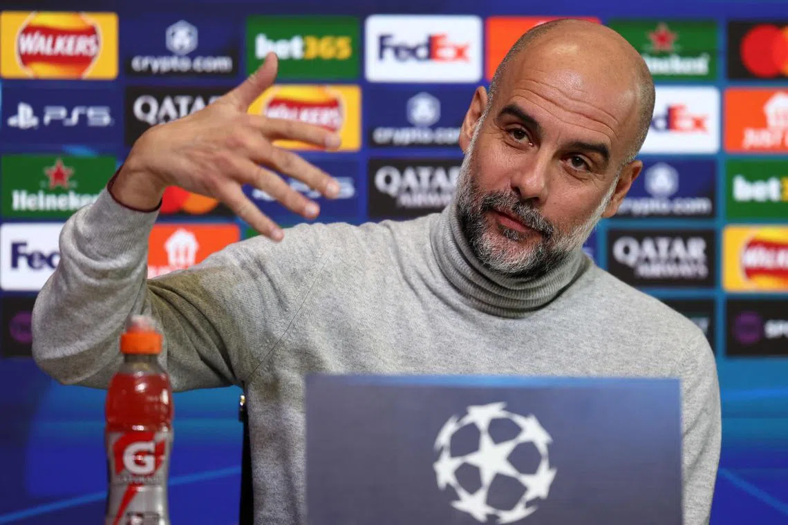 Manchester City manager Pep Guardiola answering questions during a press conference at Manchester City's training ground on Jan 28.